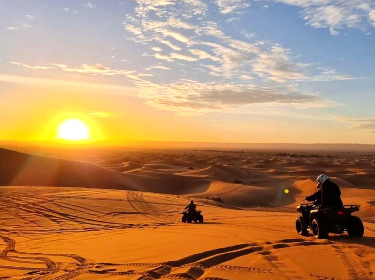 icydays | Go Quad Biking on Red Sand Dunes: Explore red sand dunes on a quad biking adventure.