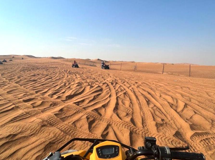 Adventure Awaits: Quad Biking on Vibrant Red Sand Dunes